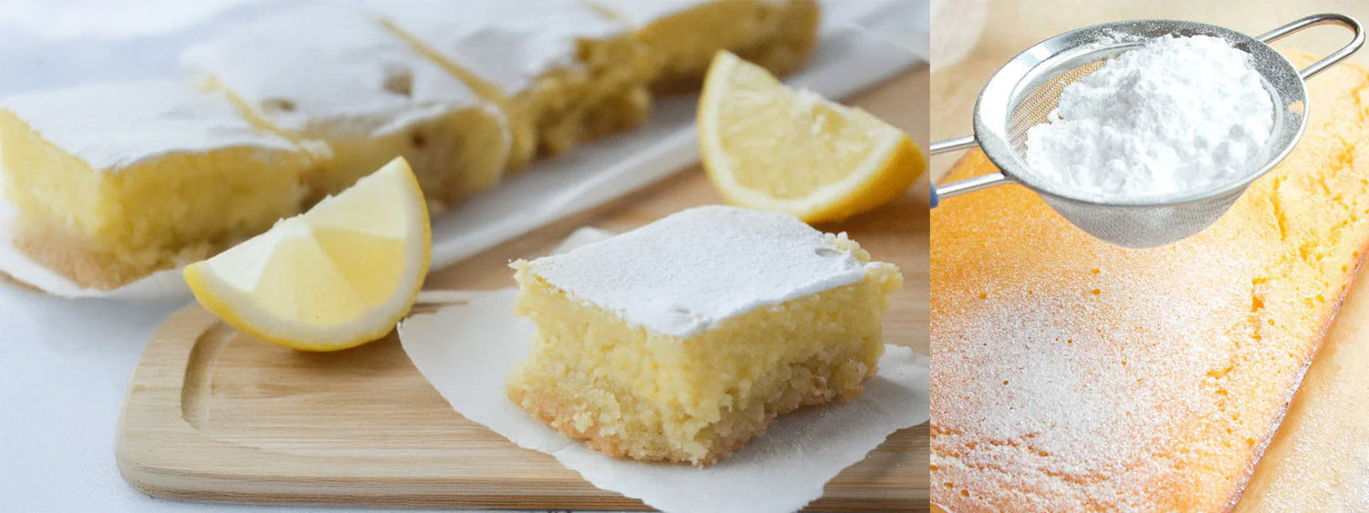Homemade keto lemon bars dusted with powdered sweetener, served with fresh lemon wedges on a wooden board, gluten-free and dairy-free dessert.
