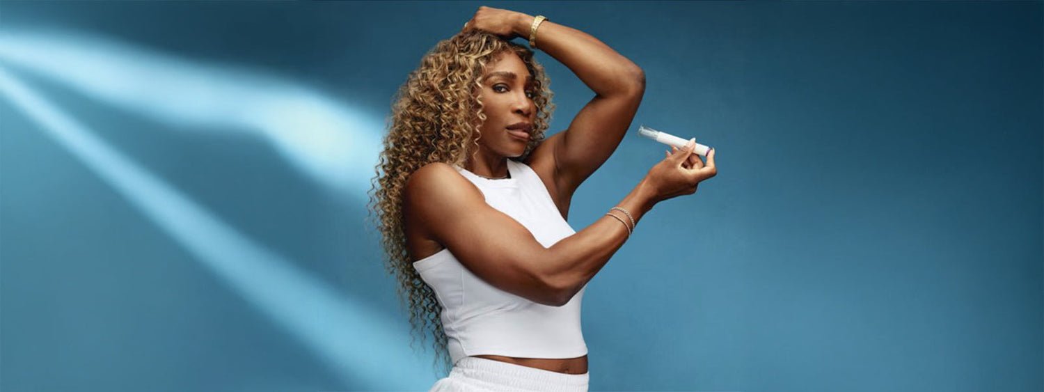Serena Williams promoting GLP-1 weight loss treatment in Ro campaign, holding injector pen against her arm while wearing a white crop top.