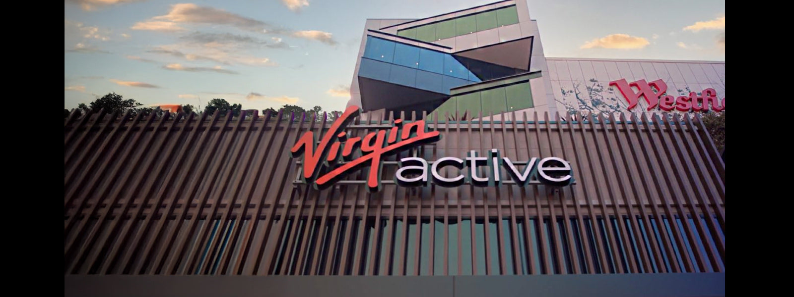 Virgin Active Bondi Westfield exterior signage at sunset, highlighting the entrance to the new Social Wellness Club inside Westfield Bondi Junction.